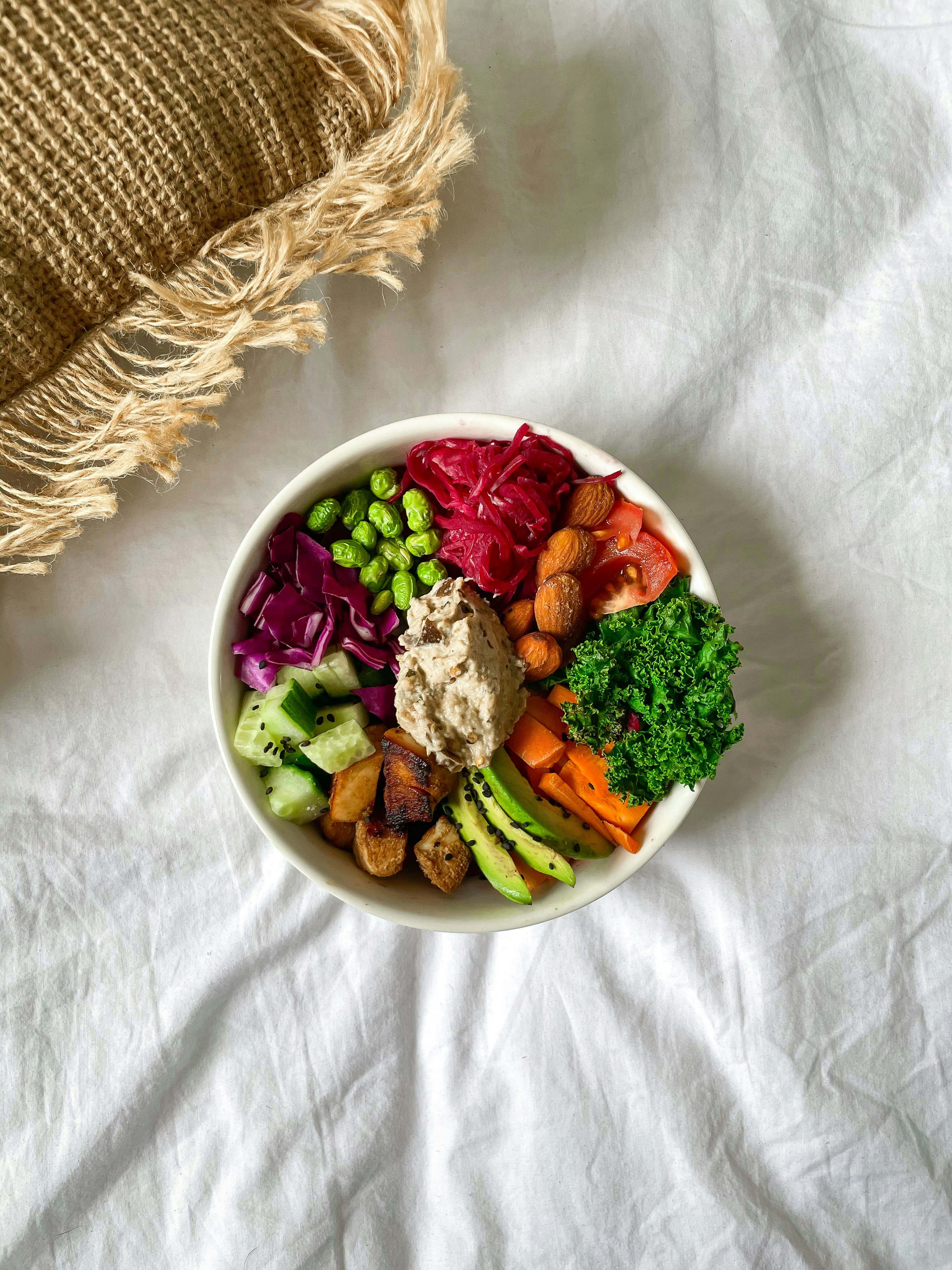 A bowl of veggies and nuts